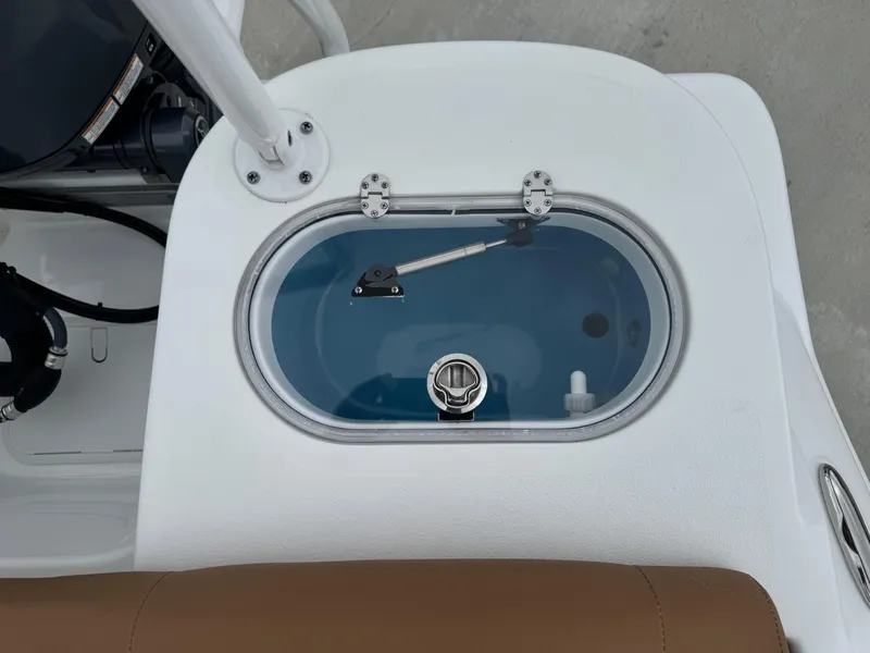 Slide: The Image of Livewell on 2024 NauticStar 212 Legacy boat, featuring a clear lid and white deck. - 15