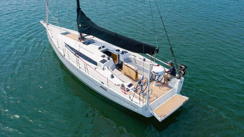 Slide: The Image of 2021 Dehler 42c sailboat on calm water, aerial view. - 0