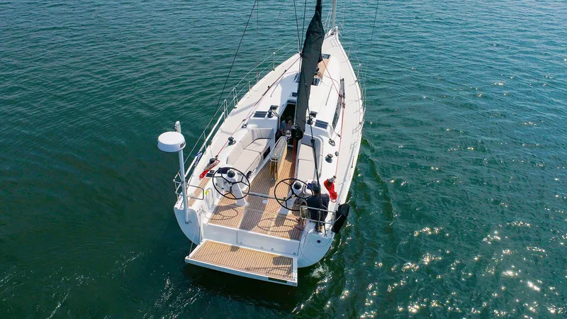 Slide: The Image of 2021 Dehler 42c sailboat on open water, aerial view. - 1