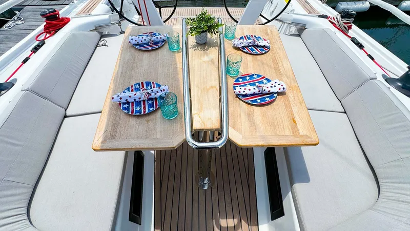 Slide: The Image of Dehler 42c 2021 yacht cockpit with dining table set for four. - 10