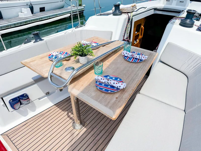 Slide: The Image of Dehler 42c 2021 yacht cockpit with dining table set for four. - 14