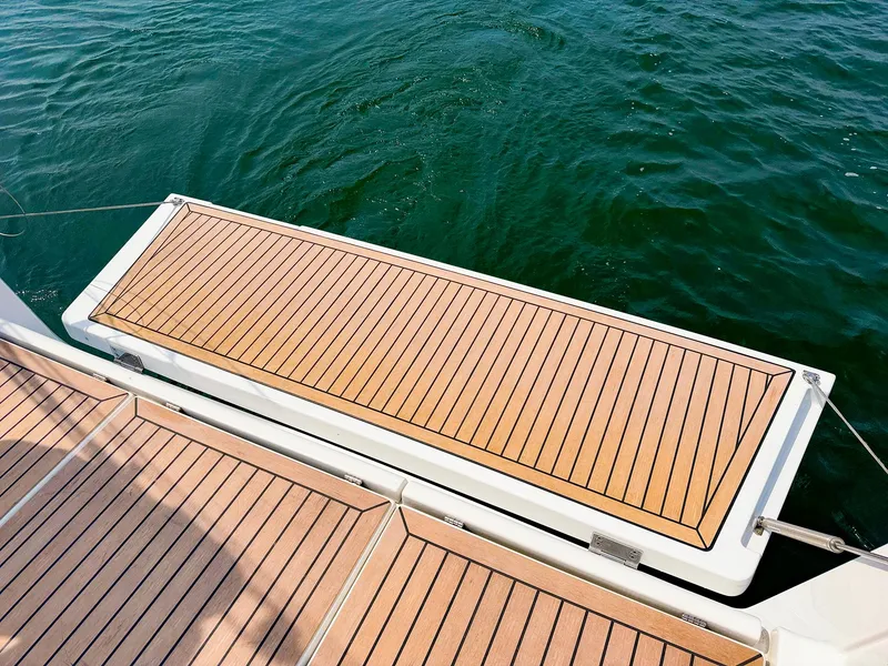 Slide: The Image of Dehler 42c 2021 yacht with teak deck, view of swim platform and water. - 15