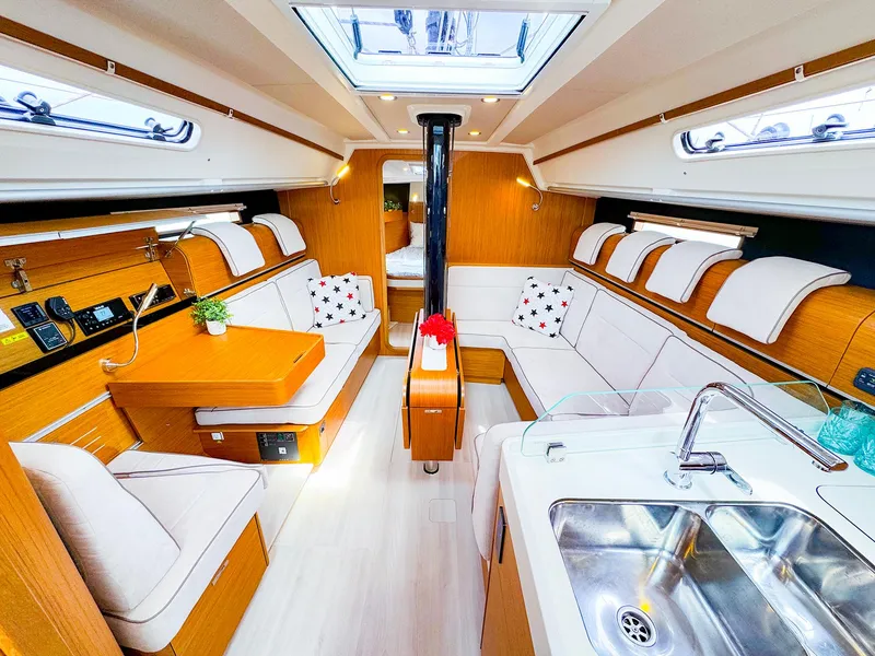 Slide: The Image of Interior of 2021 Dehler 42c sailboat with modern kitchen and cozy seating area. - 17