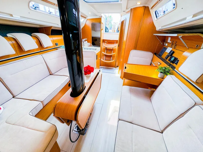 Slide: The Image of Luxurious interior of 2021 Dehler 42c sailboat with modern furnishings and ample seating. - 19
