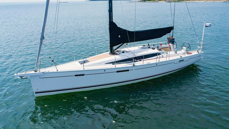 Slide: The Image of 2021 Dehler 42c sailboat on calm waters. - 2
