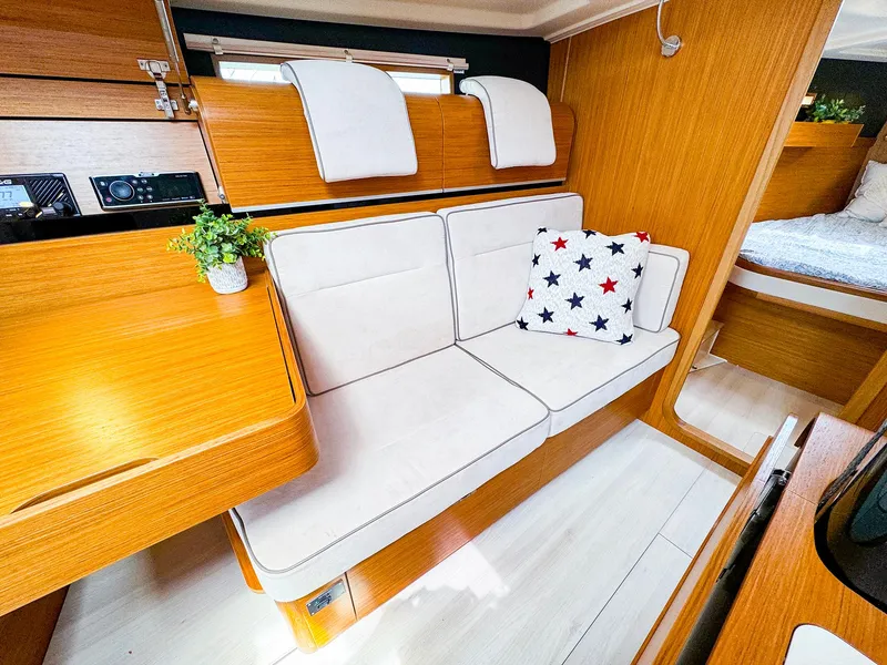 Slide: The Image of Modern interior of 2021 Dehler 42c yacht with cozy seating and star-patterned pillow. - 25