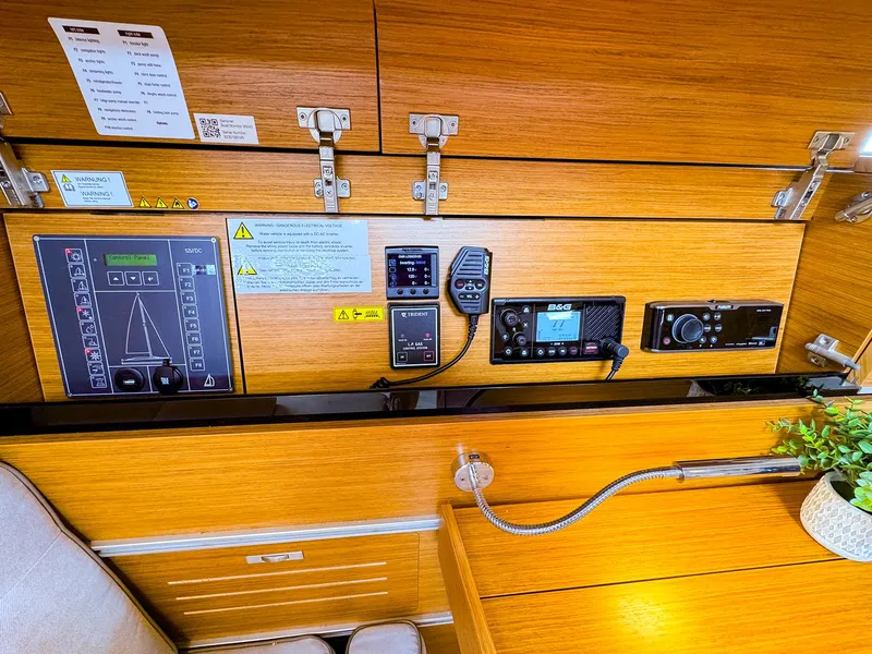 Slide: The Image of Control panel and navigation equipment inside 2021 Dehler 42c sailboat cabin. - 27