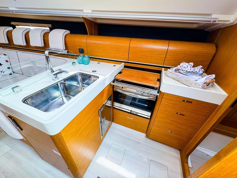 Slide: The Image of Modern kitchen in 2021 Dehler 42c yacht with double sink and wooden cabinetry. - 28