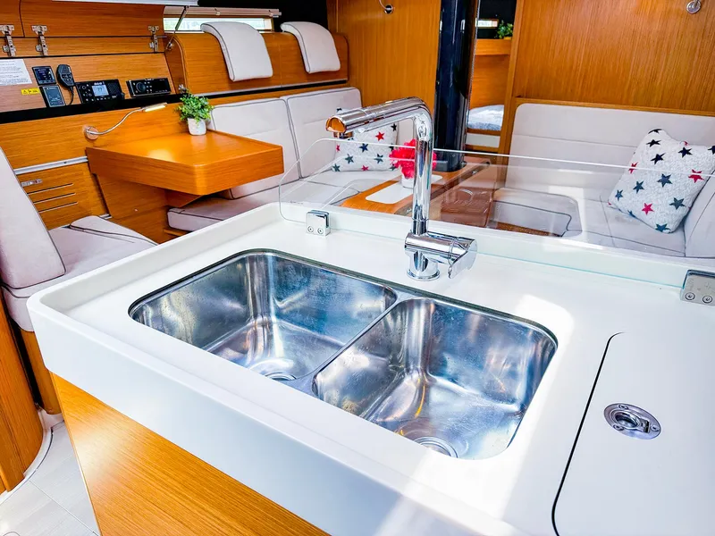 Slide: The Image of Modern interior of 2021 Dehler 42c yacht with double sink and cozy seating area. - 29