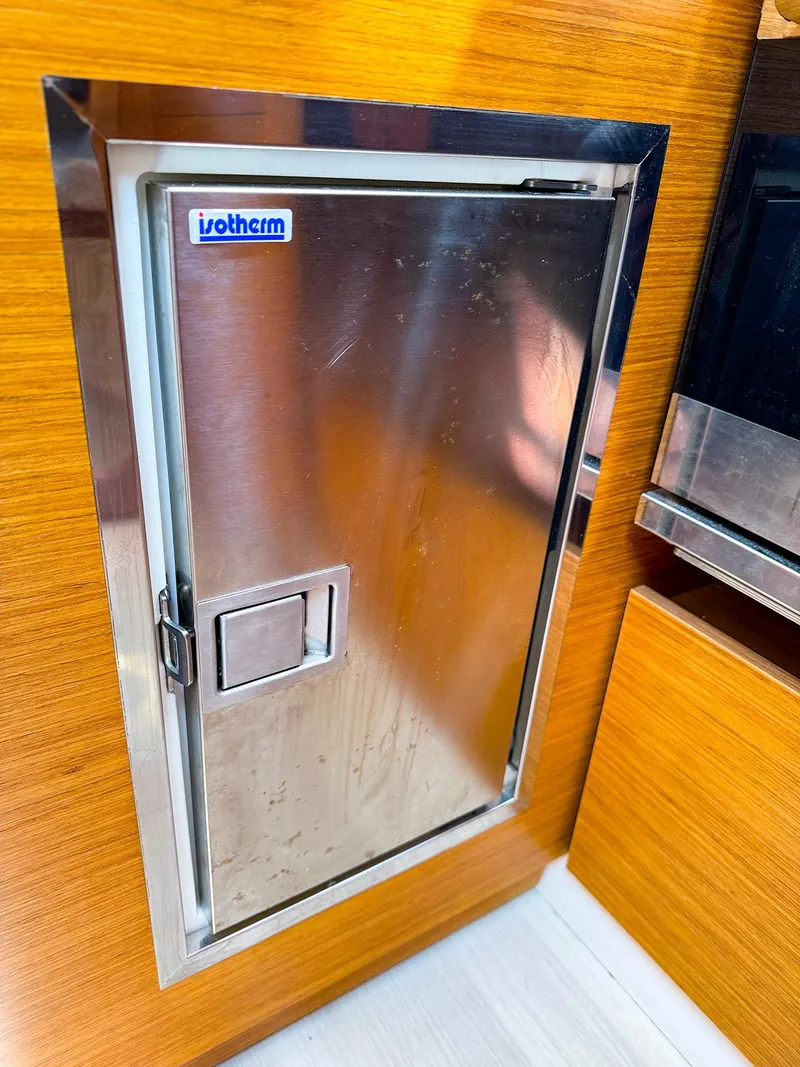 Slide: The Image of Stainless steel refrigerator door in 2021 Dehler 42c yacht interior. - 31