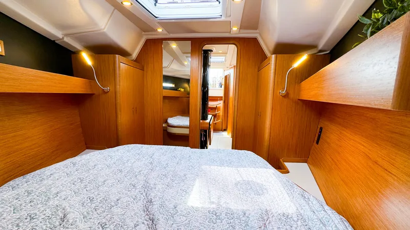 Slide: The Image of Interior cabin of 2021 Dehler 42c yacht with wooden finish and cozy bedding. - 35