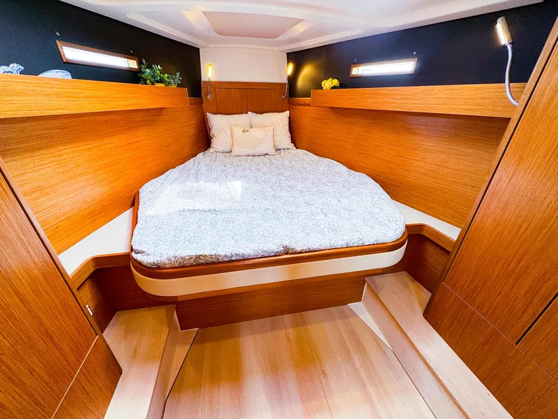 Slide: The Image of Luxurious cabin interior of 2021 Dehler 42c yacht with cozy bed and wooden finish. - 36