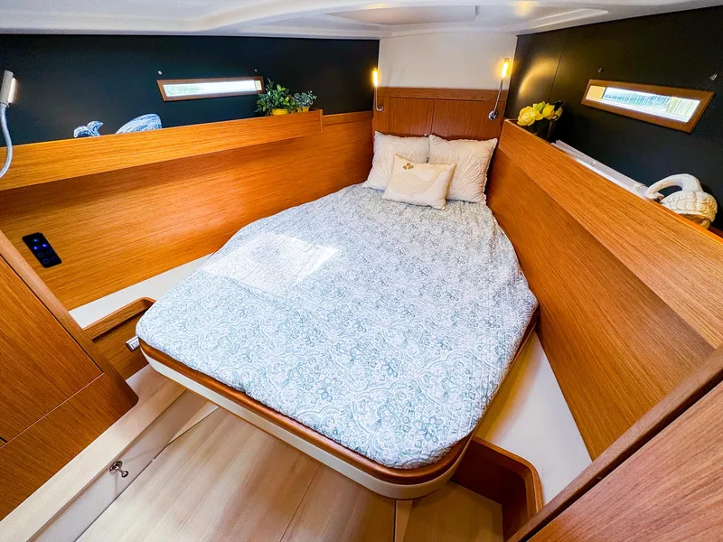 Slide: The Image of Cozy bedroom in 2021 Dehler 42c yacht with wooden interior and double bed. - 37