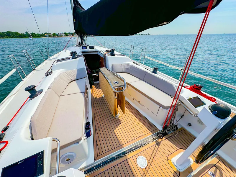 Slide: The Image of 2021 Dehler 42c sailboat with spacious cockpit and teak decking on a sunny day. - 4