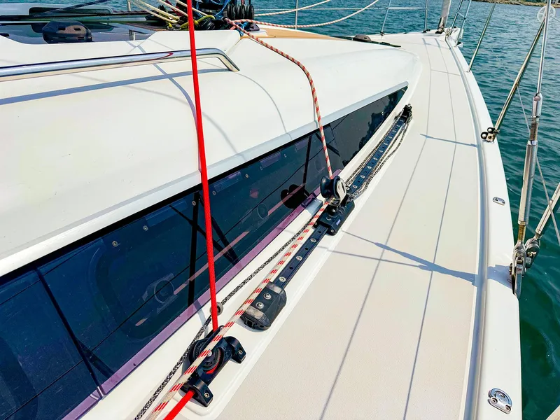 Slide: The Image of Close-up of 2021 Dehler 42c sailboat deck with rigging and sleek design. - 5