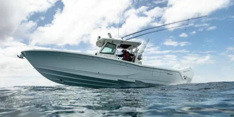 The Image of 2025 Caymas 341 CC boat on open water under cloudy sky. - 1