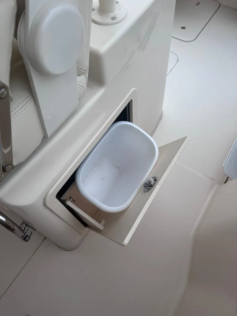 Slide: The Image of 2022 Grady-White Canyon 326 boat interior with built-in storage compartment. - 19