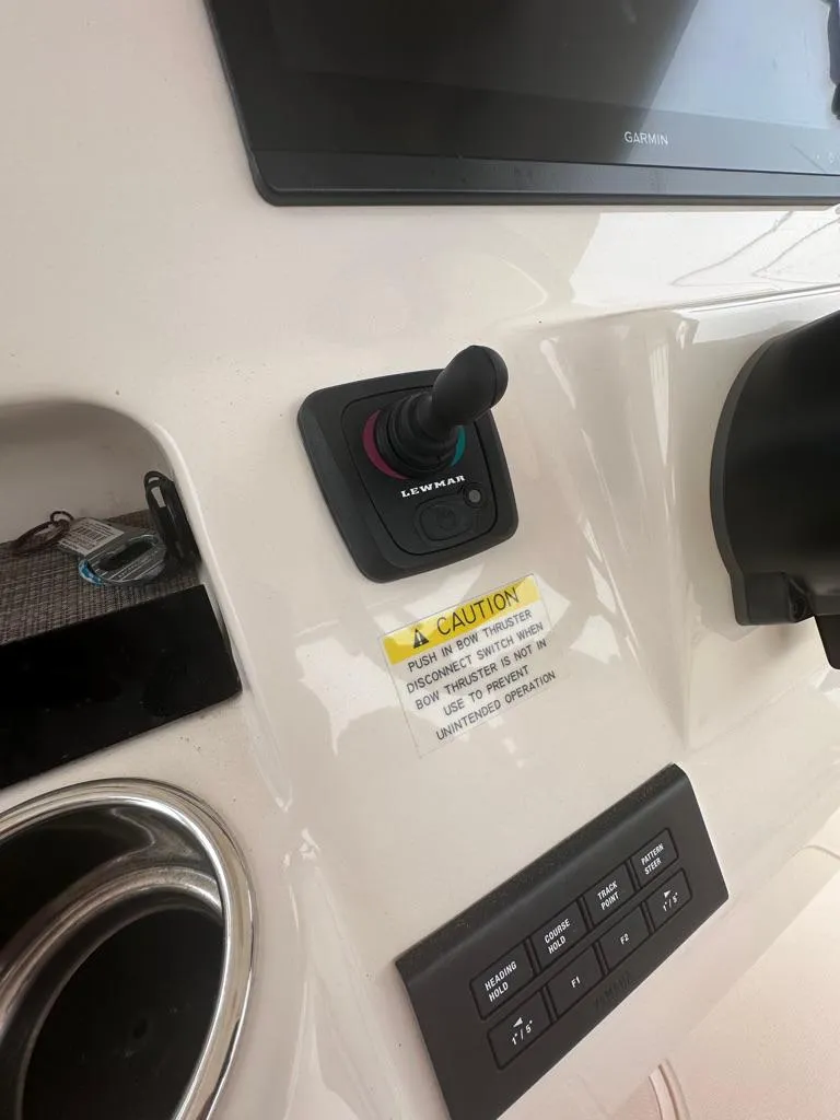 Slide: The Image of Control panel of a 2022 Grady-White Canyon 326 boat with joystick and display. - 21