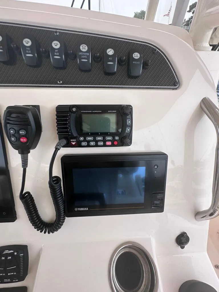 Slide: The Image of Control panel of 2022 Grady-White Canyon 326 boat with radio and display. - 23