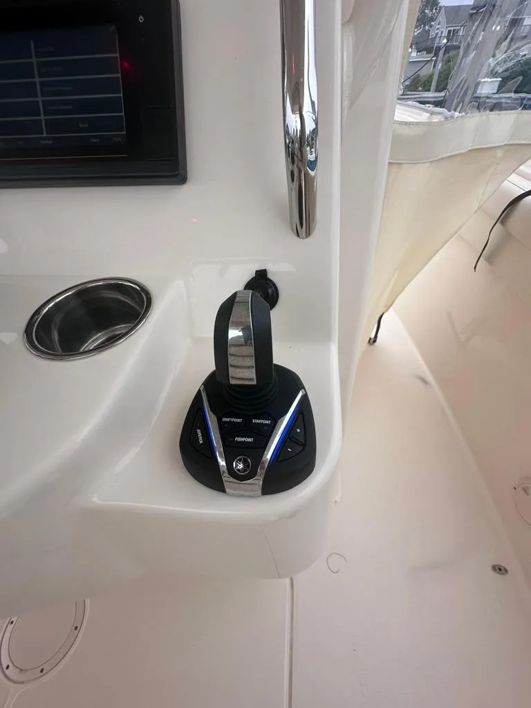 Slide: The Image of 2022 Grady-White Canyon 326 boat control panel with joystick. - 27