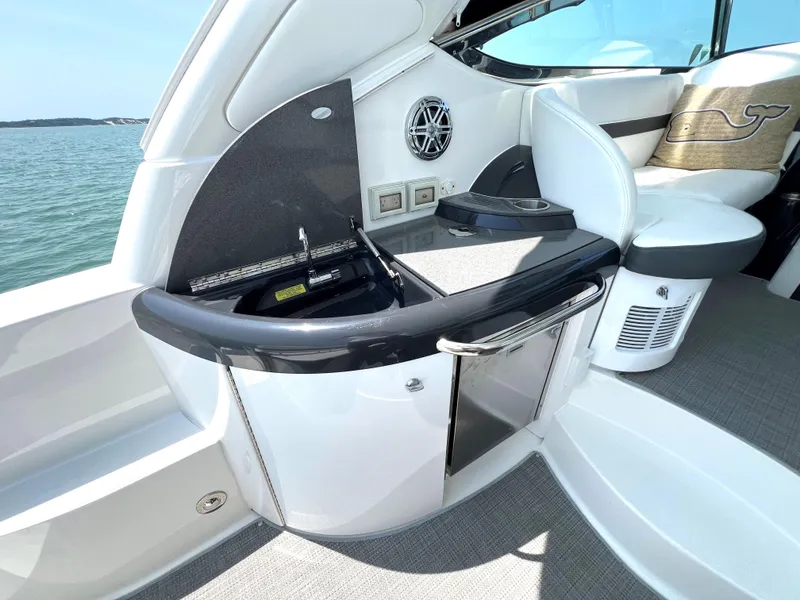 Slide: The Image of 2017 Formula 37 Performance Cruiser interior with kitchenette and seating area. - 11