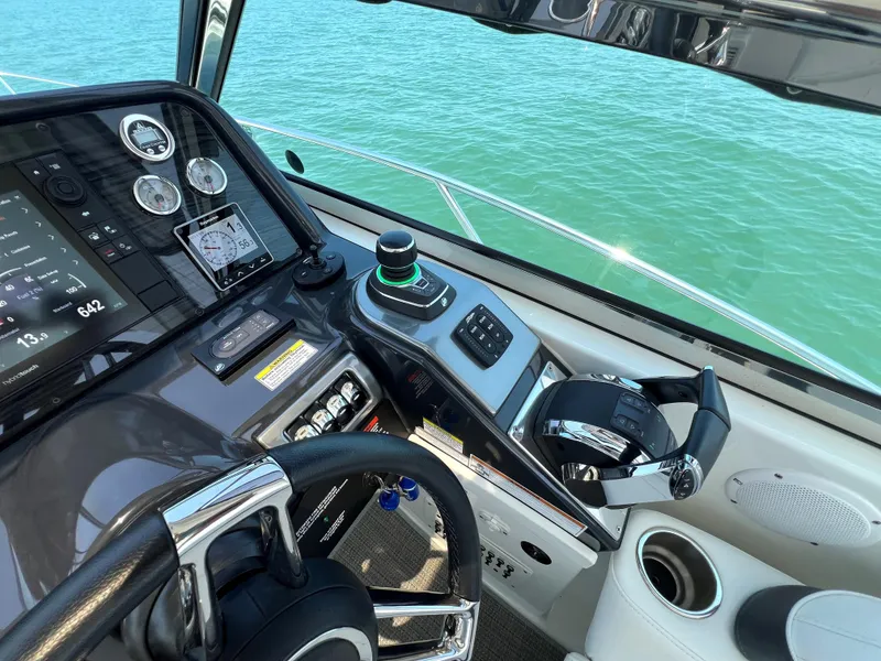 Slide: The Image of 2017 Formula 37 Performance Cruiser helm with advanced controls and navigation system. - 15