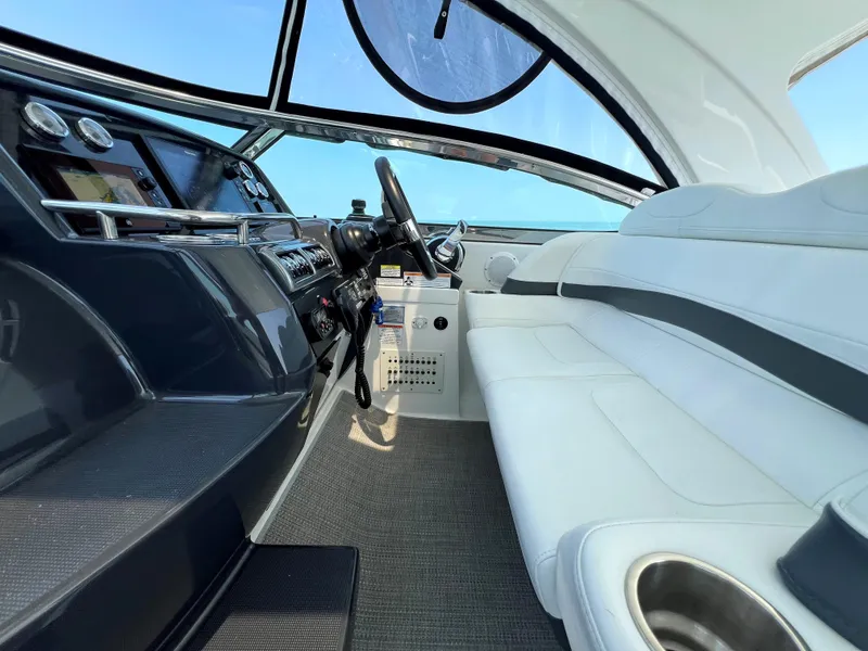 Slide: The Image of 2017 Formula 37 Performance Cruiser interior with white seating and modern dashboard. - 16