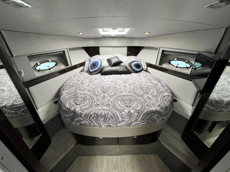 Slide: The Image of Luxurious bedroom in 2017 Formula 37 Performance Cruiser with elegant bedding and porthole windows. - 25