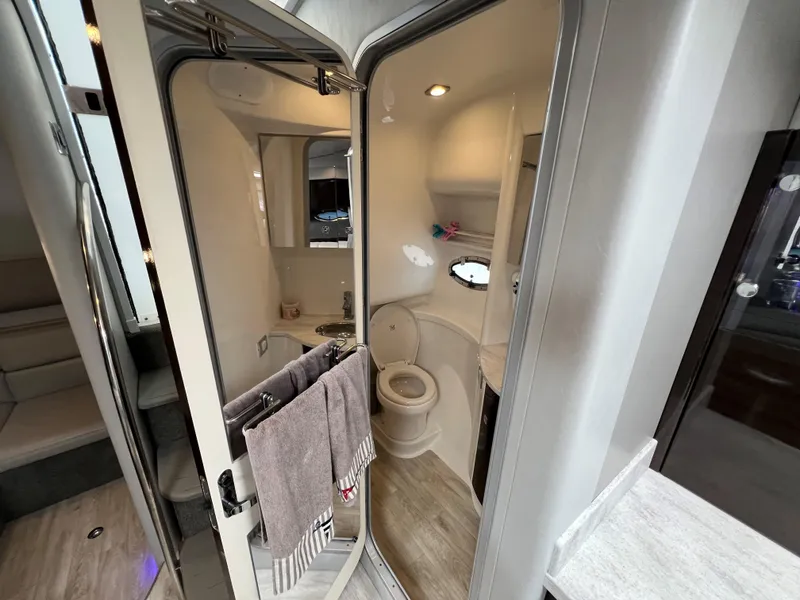 Slide: The Image of 2017 Formula 37 Performance Cruiser bathroom with modern fixtures and towels. - 28