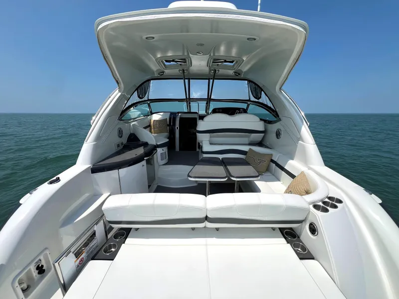 Slide: The Image of 2017 Formula 37 Performance Cruiser, spacious deck, luxury seating, ocean backdrop. - 5