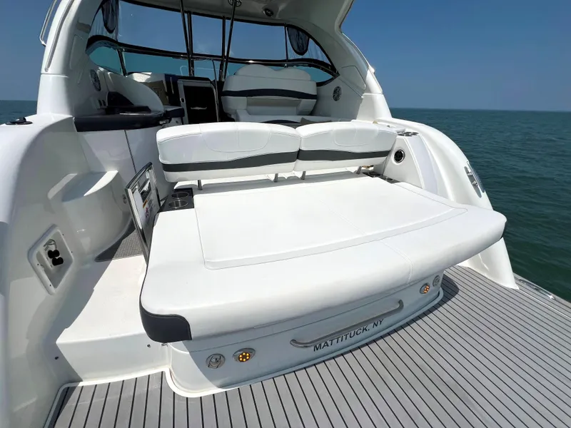 Slide: The Image of 2017 Formula 37 Performance Cruiser, rear deck view with seating, on the water. - 6