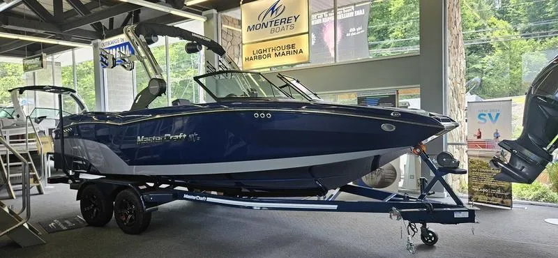 Slide: The Image of 2025 MasterCraft NXT22 boat on display at Lighthouse Harbor Marina. - 0