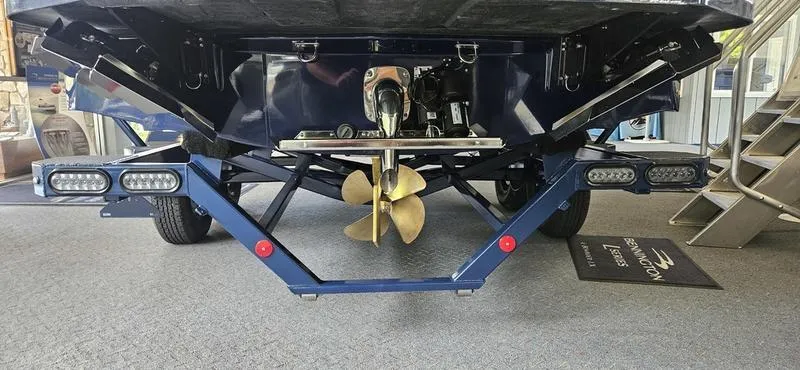 Slide: The Image of 2025 MasterCraft NXT22 boat propeller and rear view in showroom. - 3