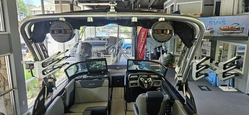 Slide: The Image of 2025 MasterCraft NXT22 boat interior with advanced sound system and sleek design. - 5
