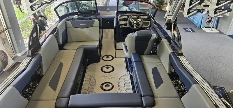 Slide: The Image of Interior of a 2025 MasterCraft NXT22 boat with luxurious seating and modern dashboard. - 6