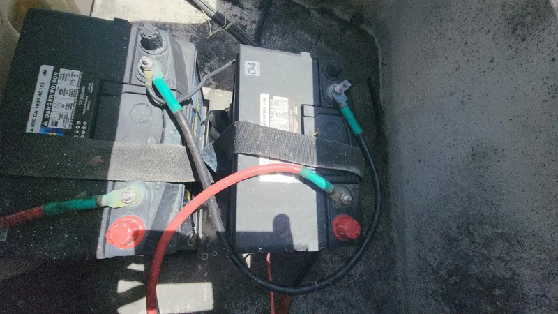 Slide: The Image of Two marine batteries secured in a 2011 Carolina Skiff 178 DLV boat. - 10