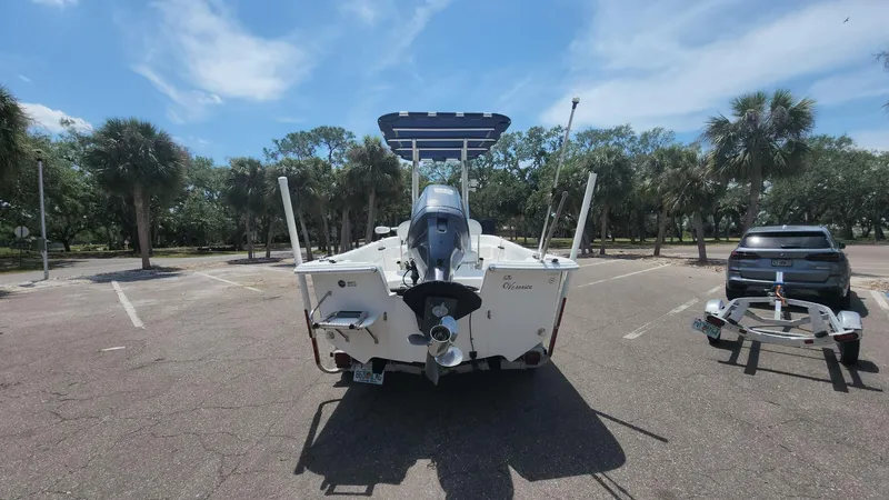 Slide: The Image of 2011 Carolina Skiff 178 DLV boat on trailer in sunny parking lot. - 15
