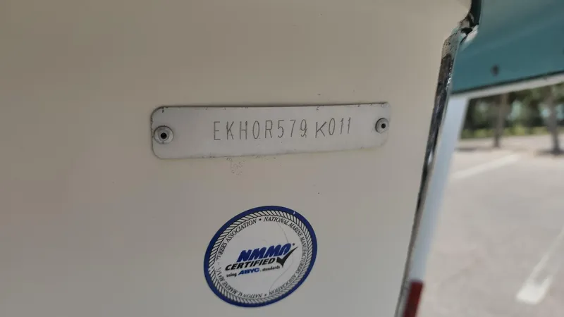 Slide: The Image of 2011 Carolina Skiff 178 DLV with visible HIN and NMMA certification sticker. - 17