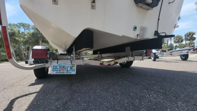 Slide: The Image of 2011 Carolina Skiff 178 DLV boat on trailer, Florida license plate visible. - 19