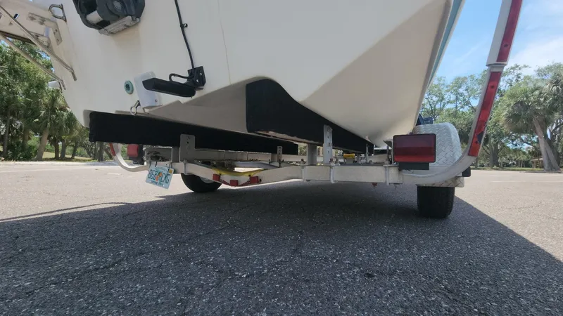 Slide: The Image of 2011 Carolina Skiff 178 DLV boat on trailer, parked outdoors. - 20