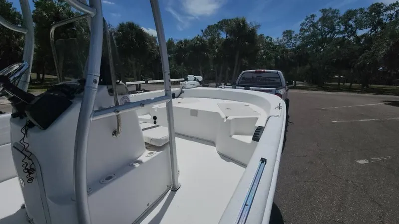 Slide: The Image of 2011 Carolina Skiff 178 DLV boat on trailer in parking lot, sunny day. - 27