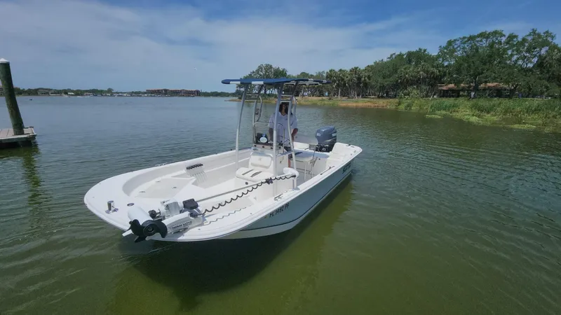 Slide: The Image of 2011 Carolina Skiff 178 DLV boat on calm water, clear sky background. - 45