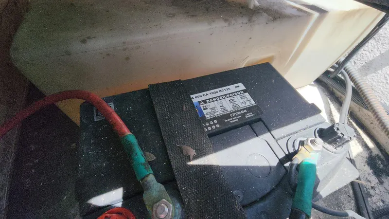 Slide: The Image of Battery compartment of a 2011 Carolina Skiff 178 DLV boat. - 9