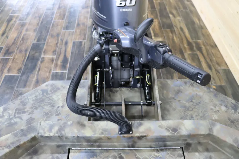 Slide: The Image of Excel 1751 Viper F4 2025 boat with Yamaha 60 outboard motor, camo pattern. - 11