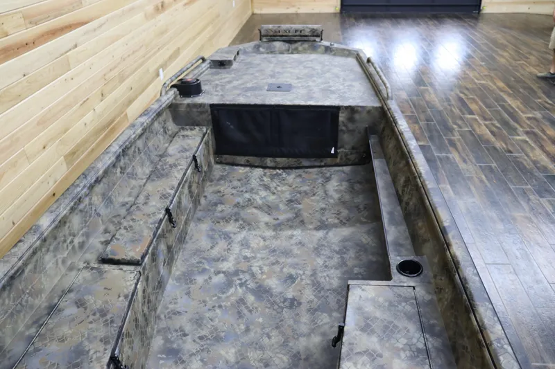 Slide: The Image of 2025 Excel 1751 Viper F4 boat interior with camouflage design in a wooden showroom. - 19
