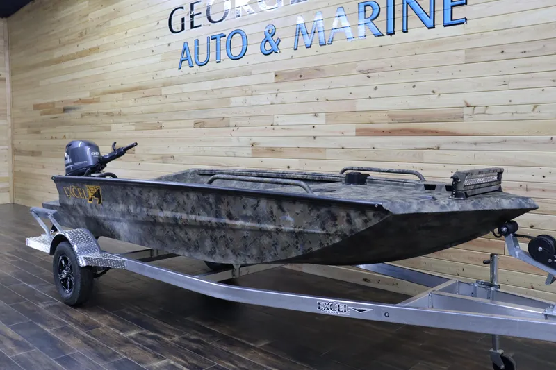 Slide: The Image of 2025 Excel 1751 Viper F4 boat on trailer at dealership. - 2