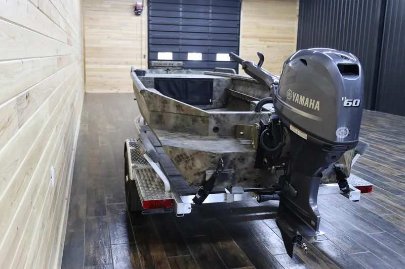 Slide: The Image of 2025 Excel 1751 Viper F4 boat with Yamaha 60 outboard motor in a wooden garage. - 5