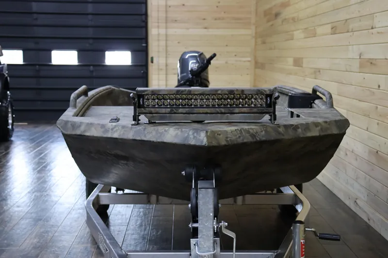 Slide: The Image of 2025 Excel 1751 Viper F4 boat in a wooden garage, front view. - 7