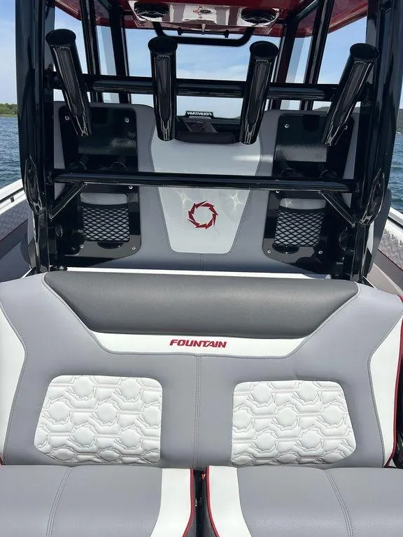 Slide: The Image of 2024 Fountain 32 NX boat interior with stylish seating and rod holders. - 12