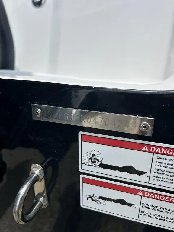 Slide: The Image of 2024 Fountain 32 NX boat hull identification number and safety warnings. - 14